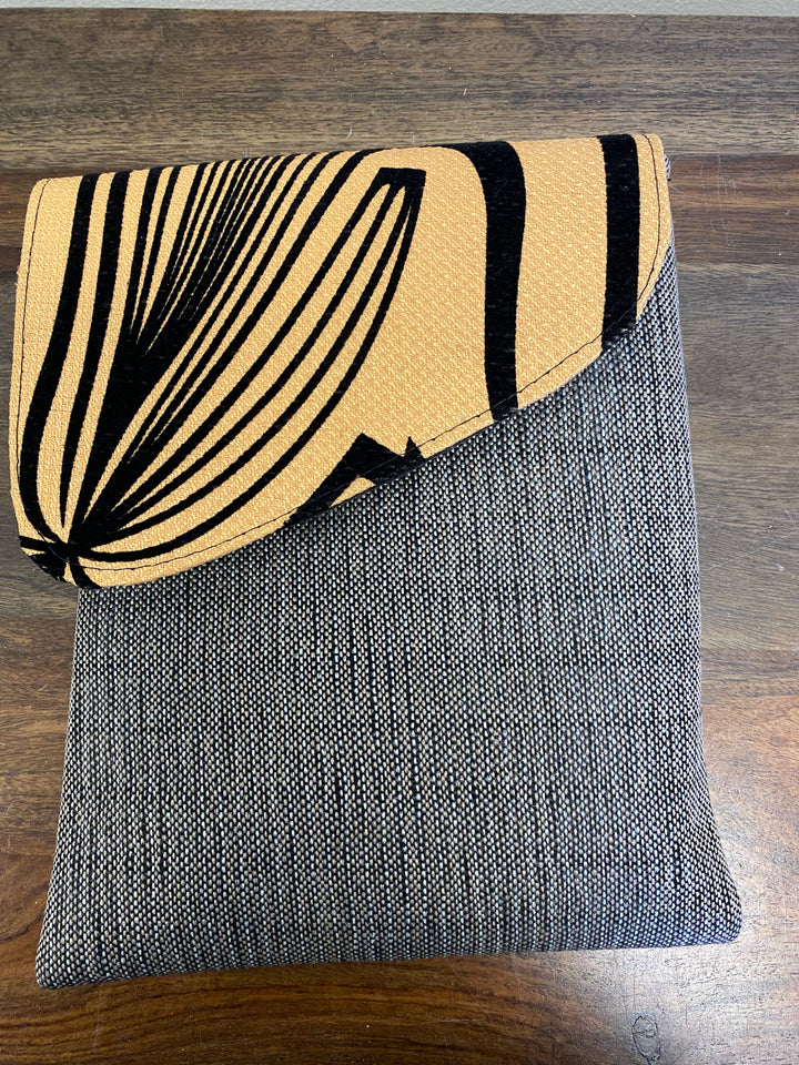 Zebra printed flap crossbody bag with a grey base.