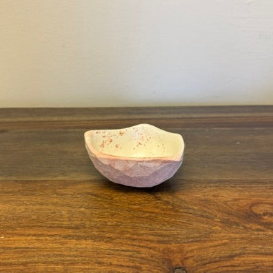 Hand carved soapstone catch-all bowl with organic shape and natural stone finish