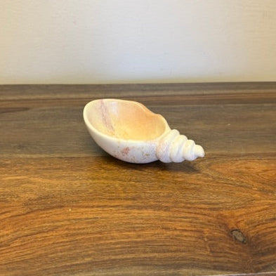 Hand carved soapstone catch-all bowl in snail shape with natural stone color