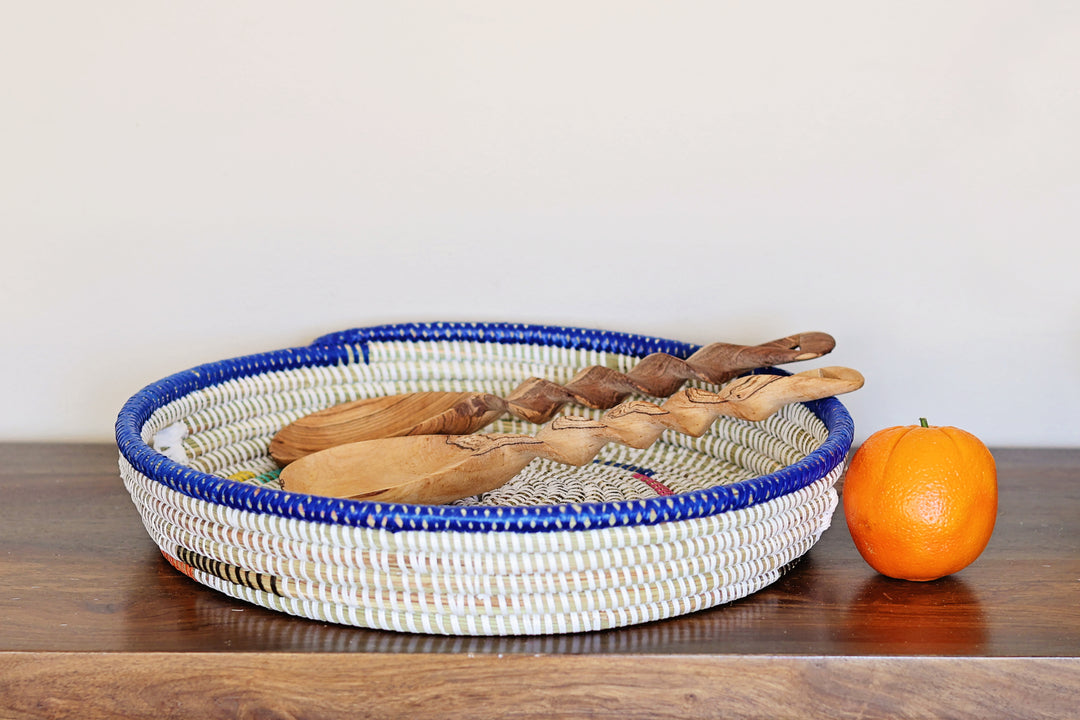 Hand carved wooden serving spoons with twisted spiral handles made by Kenyan artisans