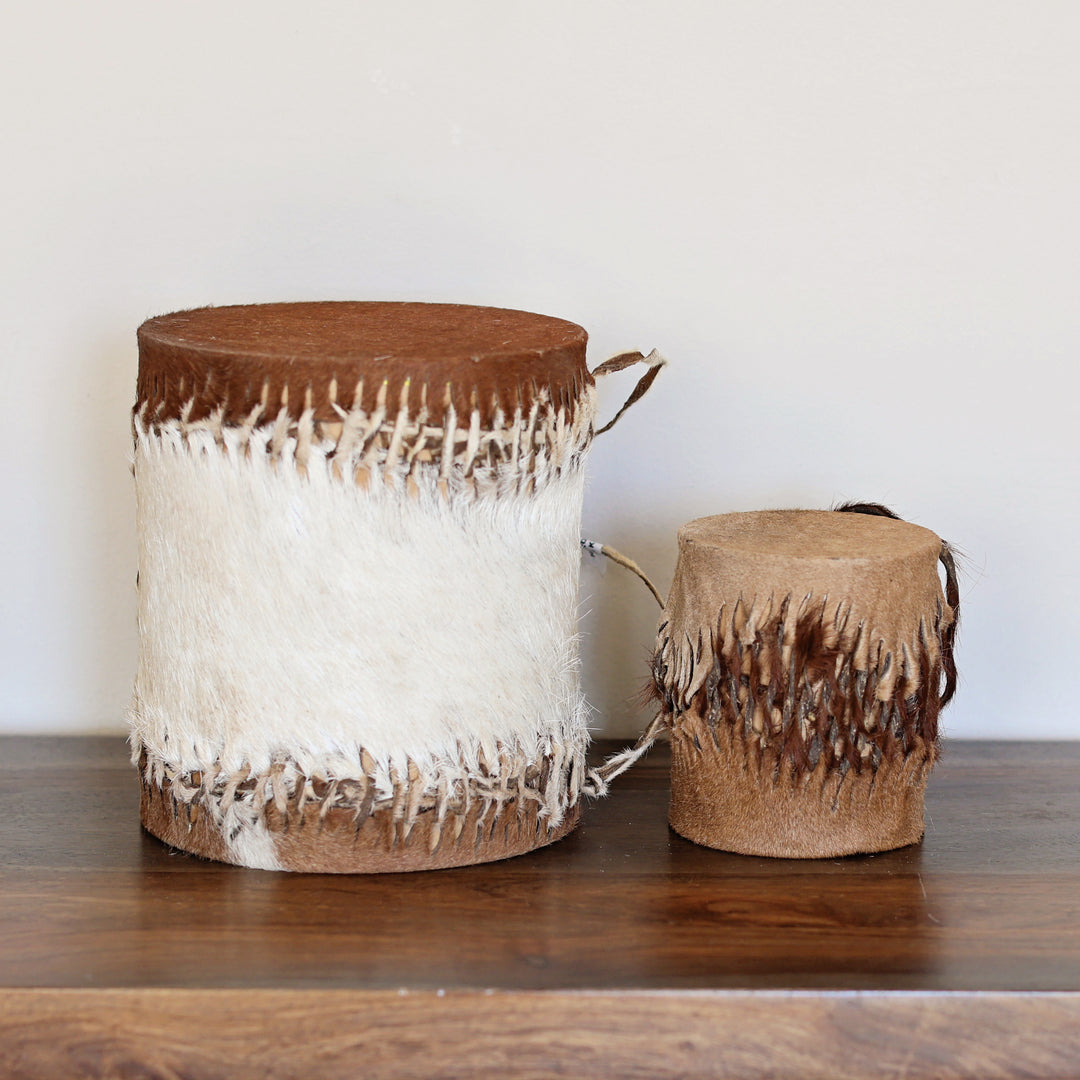 Handcrafted double sided African drum made in Kenya with wood and goat skin, in two sizes.