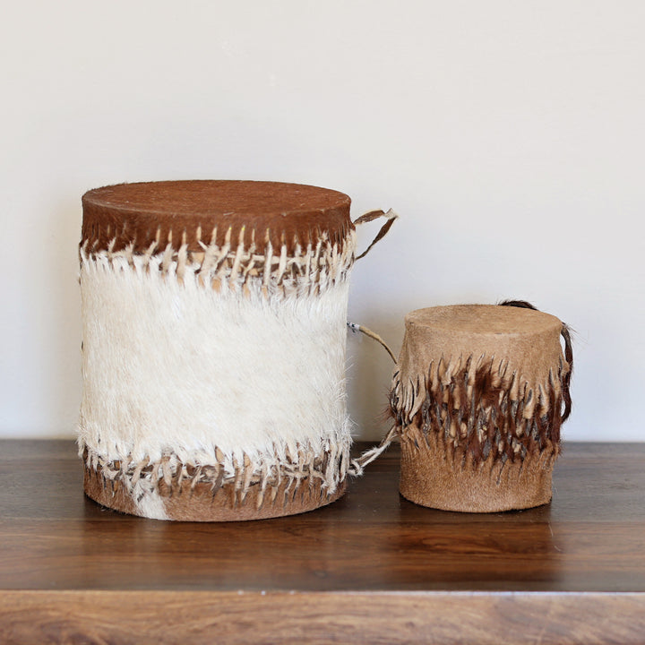 Handcrafted double sided African drum made in Kenya with wood and goat skin, in two sizes.