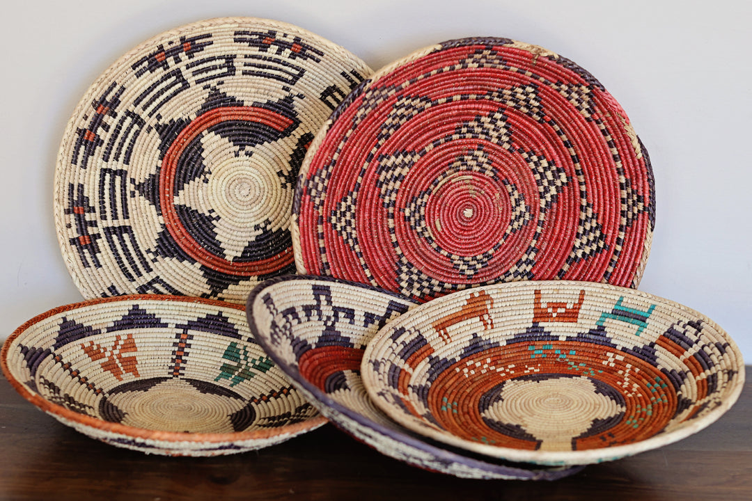 Handcrafted grass woven bowls in assorted designs and natural tones