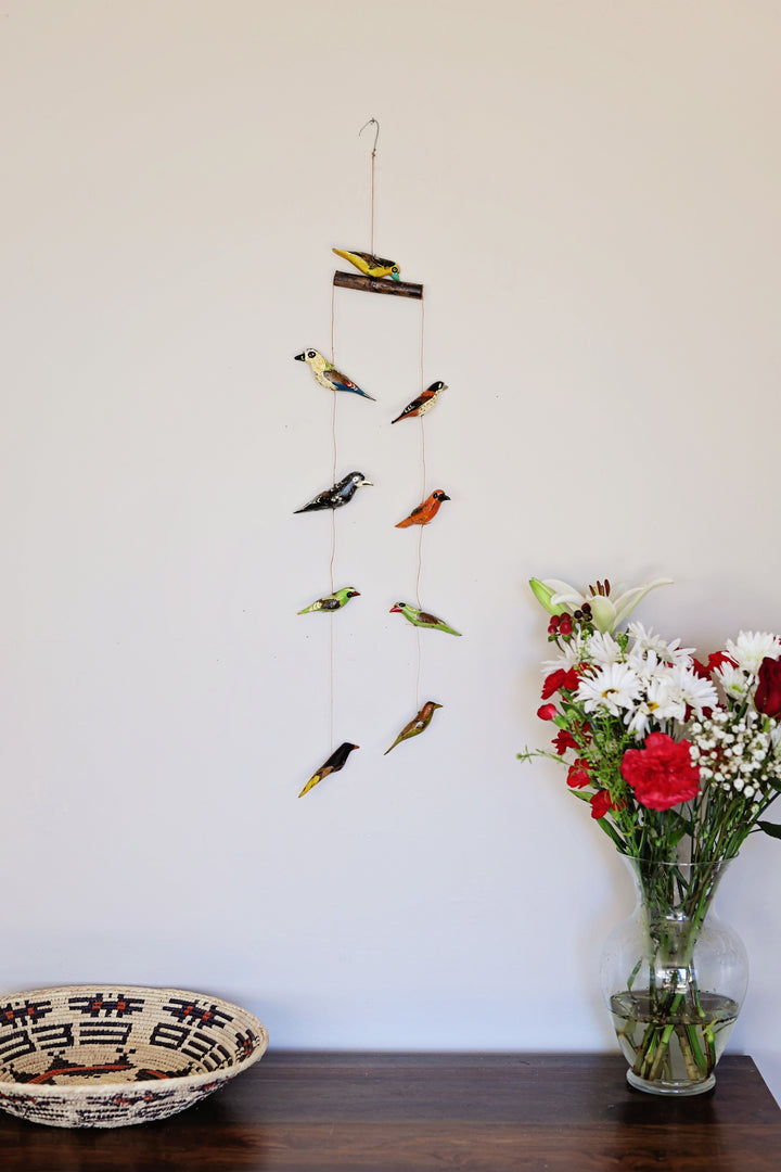 Kenyan artisan bird mobile featuring nine hand-painted wooden birds which is great hanging decor