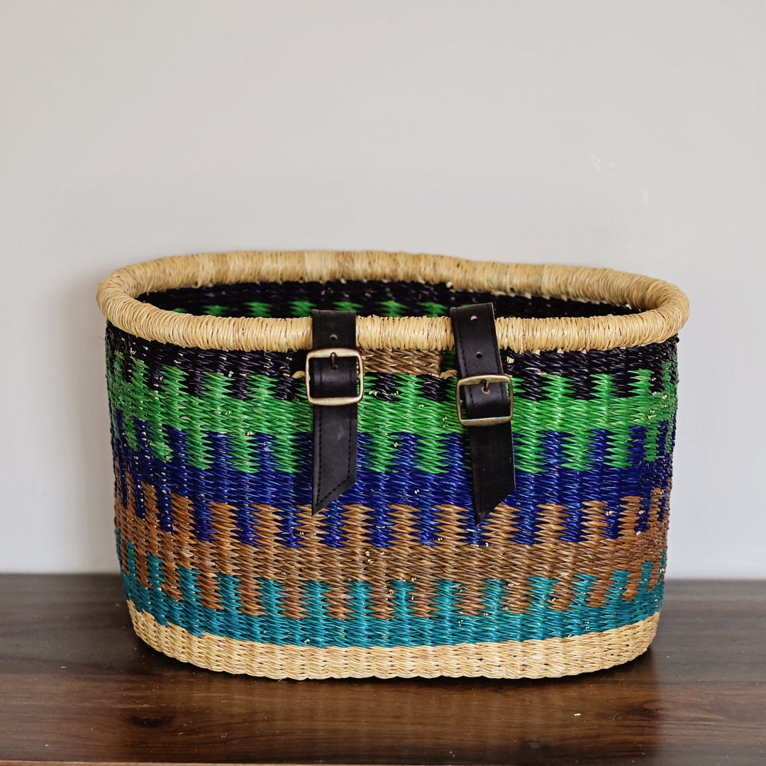 Handwoven fair trade bicycle basket from Ghana attached to a bike for stylish storage and everyday cycling