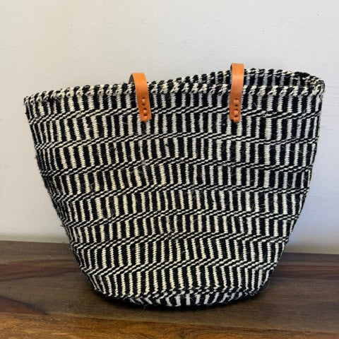 Handwoven sisal carryall tote bag with long handle and leather trim made in Kenya