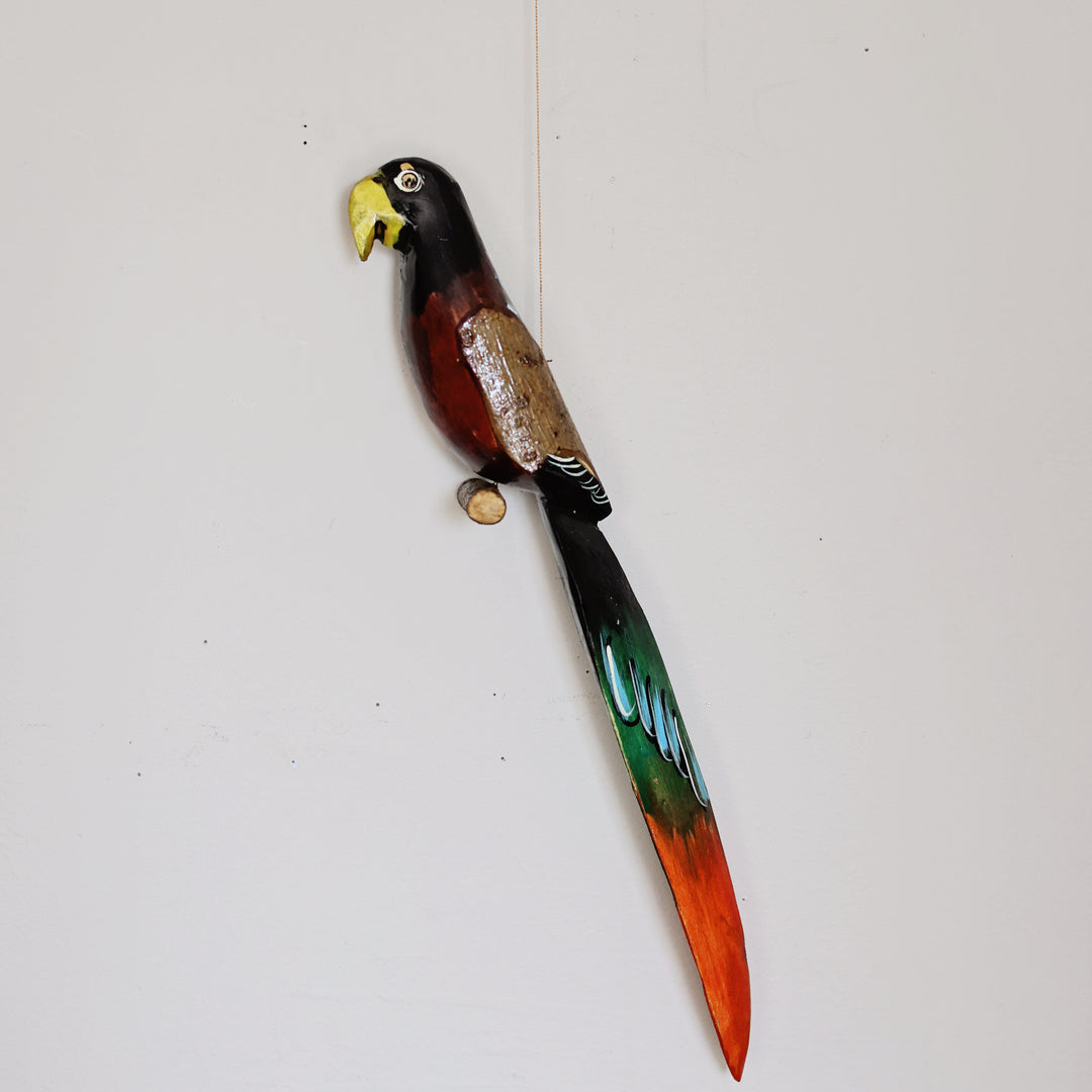 Colorful handcrafted Hanging Wood Parrot made from sustainable Jacaranda wood with hand-painted details by Kenyan artisans.