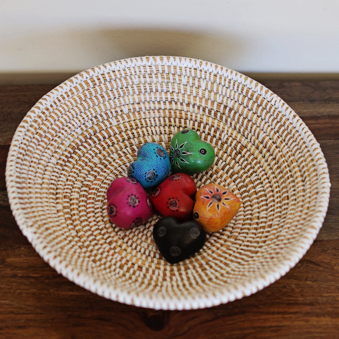 Handmade Kenya soapstone heart used as paperweight or decorative object.