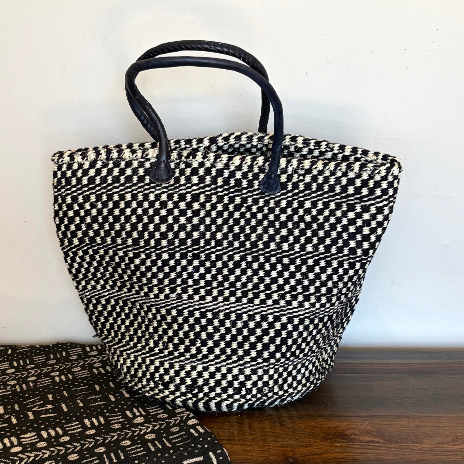 Black and white sisal everyday tote bag handwoven in Kenya with leather trim