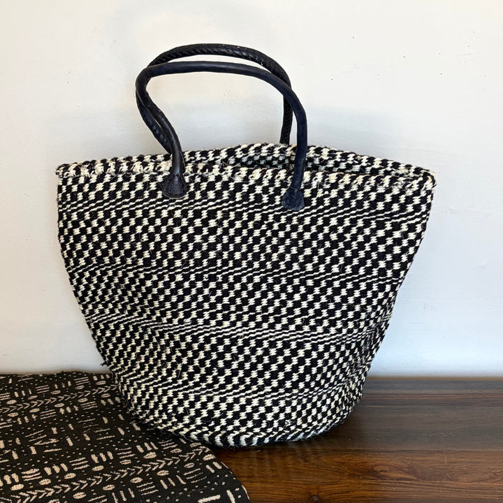 Black and white sisal everyday tote bag handwoven in Kenya with leather trim