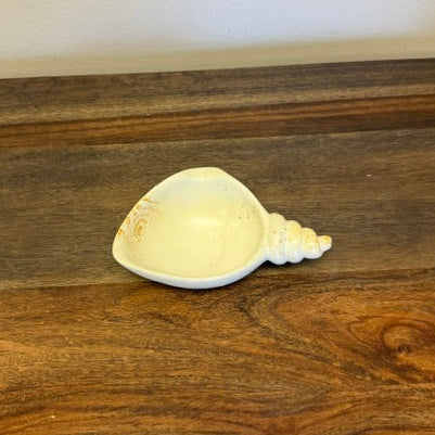 Kisii stone bowl with twisted end in natural finish approximately 4 inch diameter.