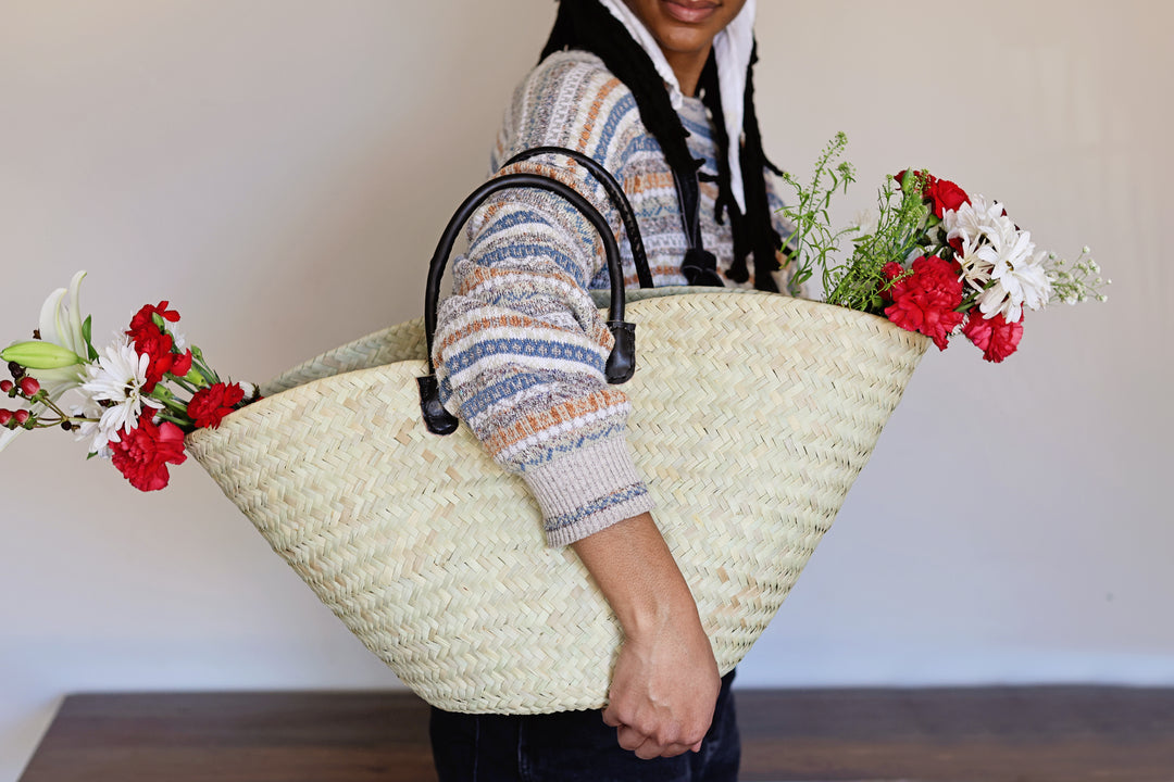 Large palm leaf market basket, perfect for a weekend outing or a beach bag.