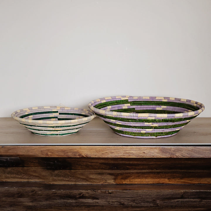 Side view of a Lavender Meadow Bukedo and Raffia bowl handcrafted in Uganda from banana leaf stalks and palm raffia in lavender, sage green, and natural tones.