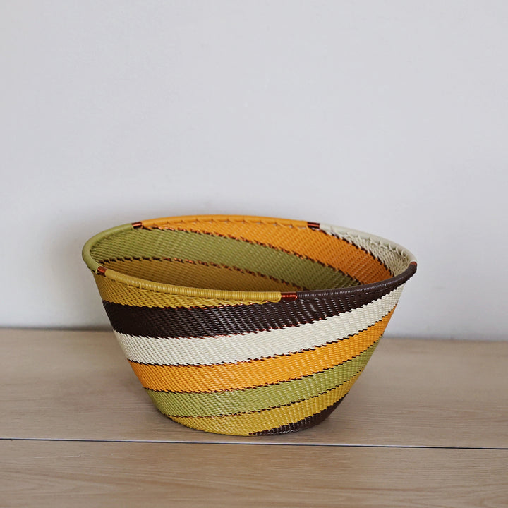 Light Earth Zulu Wire Deep Bowl handwoven in South Africa in warm ivory, ochre, sage, and earthy brown tones.