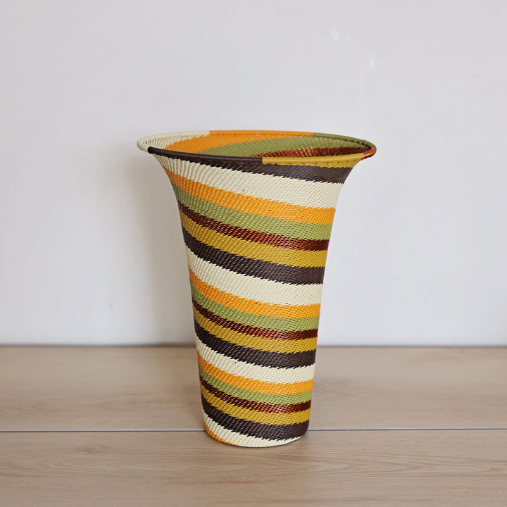 Light Earth Zulu Wire Flared Vase handwoven in South Africa in warm ivory, ochre, sage, and earthy brown tones.