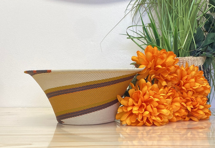Light Earth Zulu Wire Large Flared Bowl handwoven in South Africa in warm ivory, ochre, sage, and earthy brown tones.