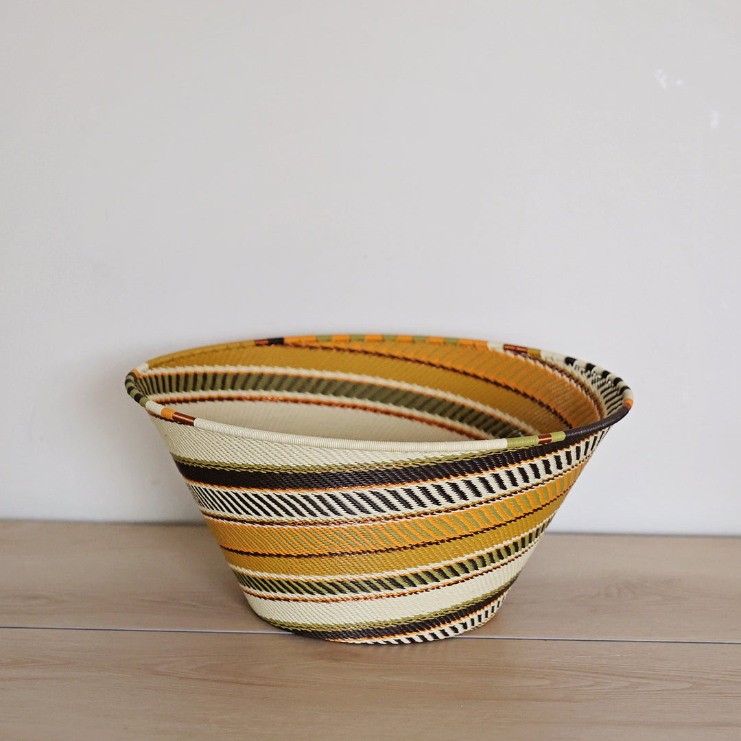 Light Earth Zulu Wire Large Funnel Bowl handwoven in South Africa in warm ivory, ochre, sage, and earthy brown tones.