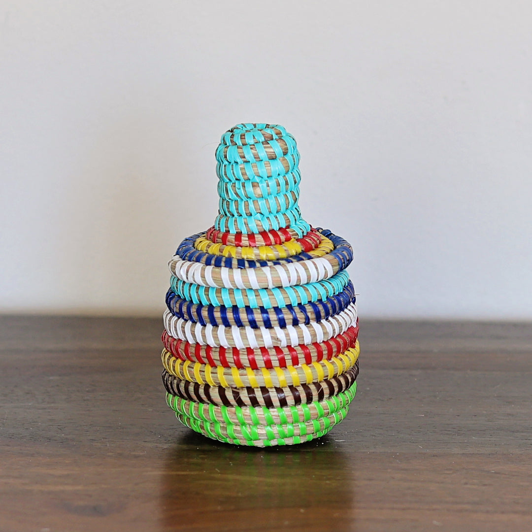 Handwoven mini rainbow sweetgrass basket with lid handcrafted in Senegal.