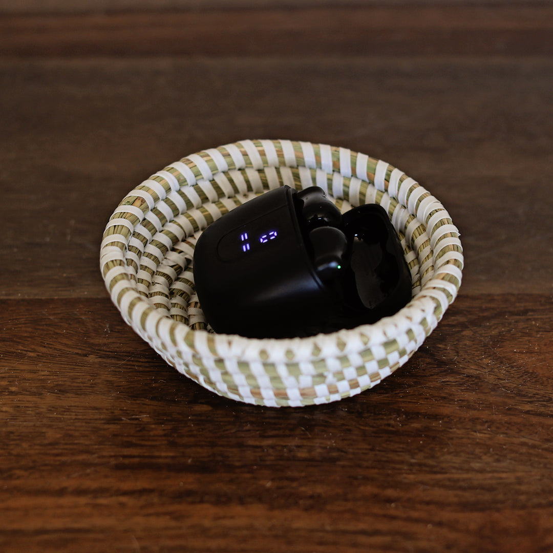 Mini sweetgrass baskets used as catch all bowls for keys and jewelry and earbuds.