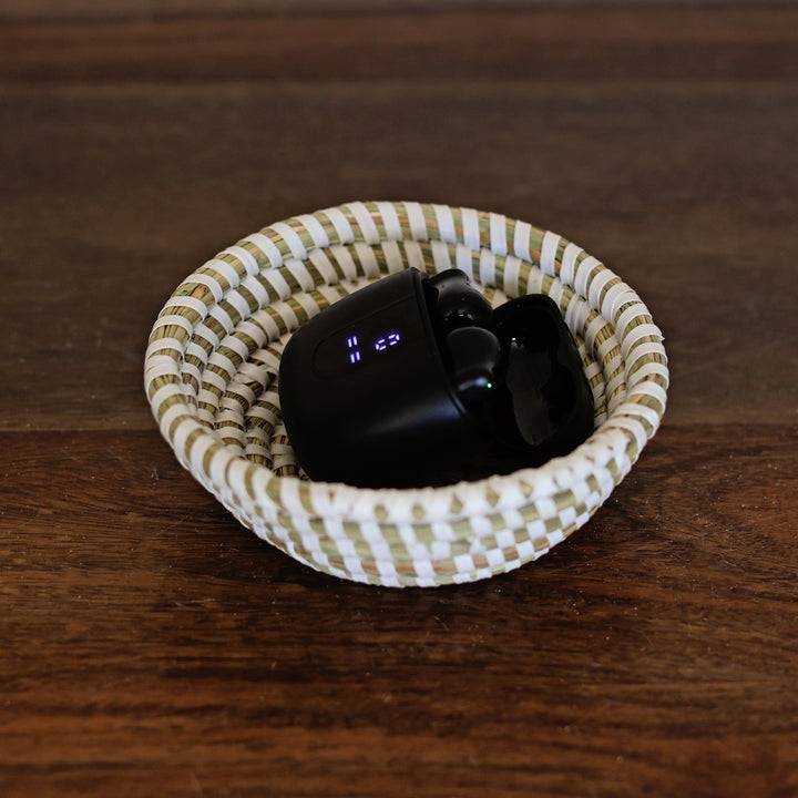Mini sweetgrass baskets used as catch all bowls for keys and jewelry and earbuds.