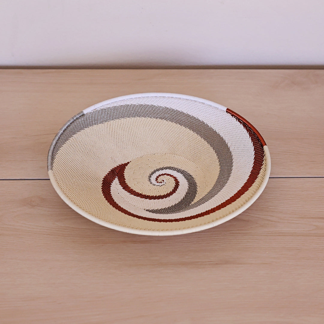 Mist Zulu Large Shallow Basket handwoven in South Africa with soft mist gray and white tones in a diagonal stripe pattern.