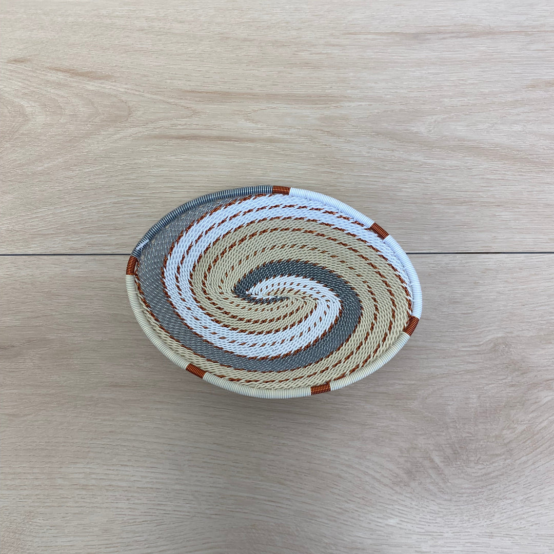 Mist Zulu Wire Oval Tray handwoven in South Africa in ivory, white, and soft gray.