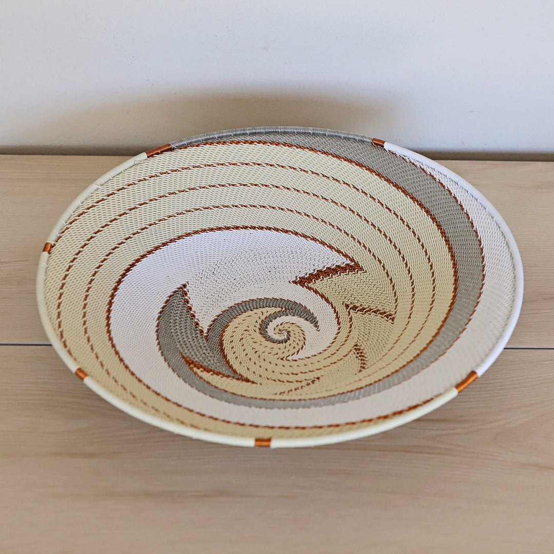 Mist Zulu Wire [Style Name] handwoven in South Africa in ivory, white, and soft gray.