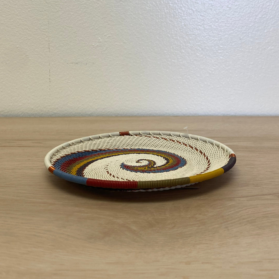 South African Zulu wire small tray basket in the Mountain Rainbow colorway with natural cream and colorful diagonal stripes.