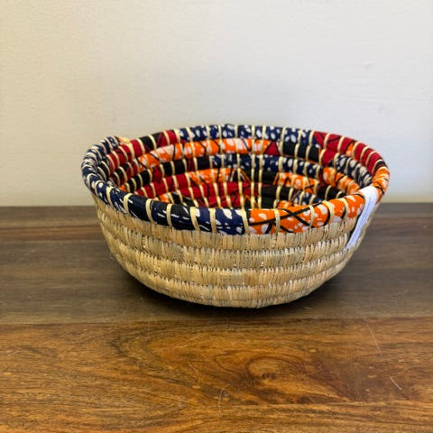 Mutli-colored trim bread basket in a round shape, good for proofing bread or decoration.