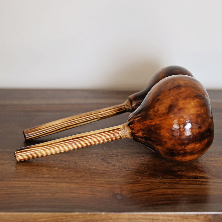 Kenyan hand-carved gourd percussion instrument made by skilled artisans.