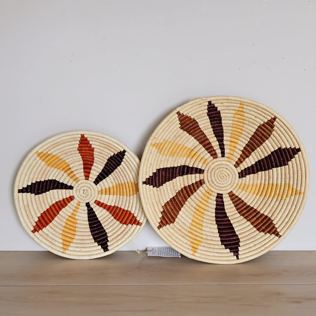 Handwoven Natural Leaf Bukedo and Raffia bowl handmade in Uganda featuring a botanical leaf design for fair trade wall décor.
