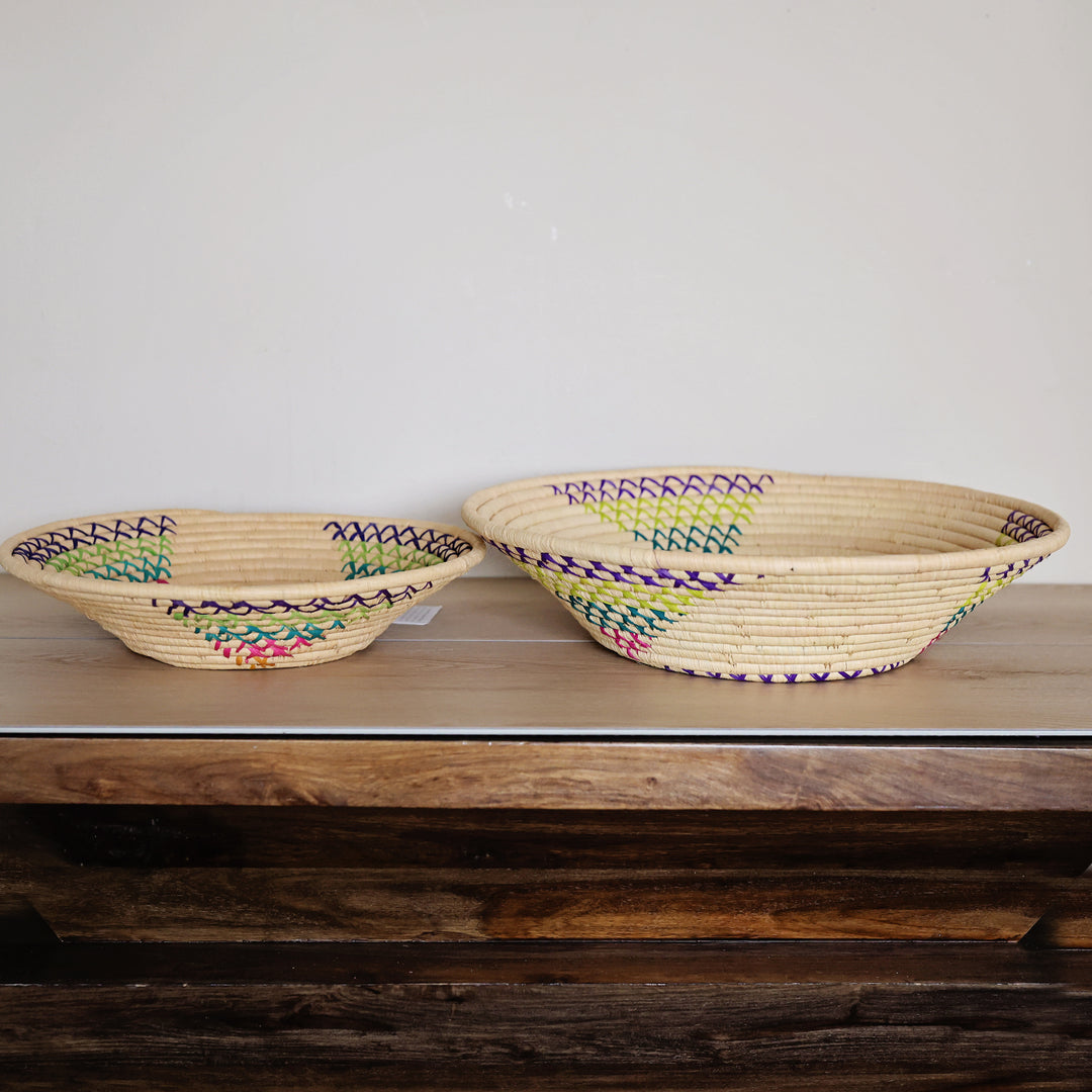 Side view of a Natural & Rainbow Bukedo and Raffia bowl handcrafted in Uganda from banana leaf stalks and palm raffia.