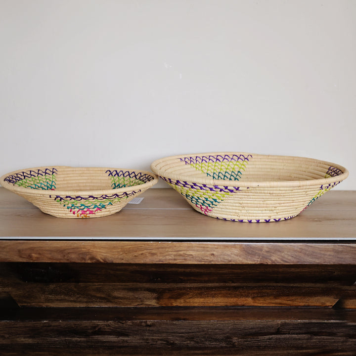 Side view of a Natural & Rainbow Bukedo and Raffia bowl handcrafted in Uganda from banana leaf stalks and palm raffia.