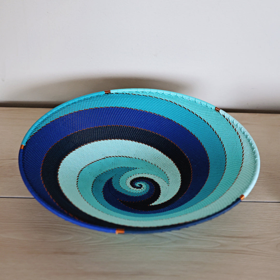 Handwoven South African Zulu small tray wire basket in vibrant Ocean shades of turquoise, aqua and blue.