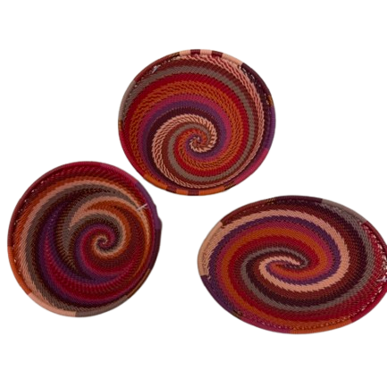 Assorted Orchid Zulu Wire Baskets handwoven in South Africa in rich burgundy, berry, plum, dusty pink, and warm coral tones.