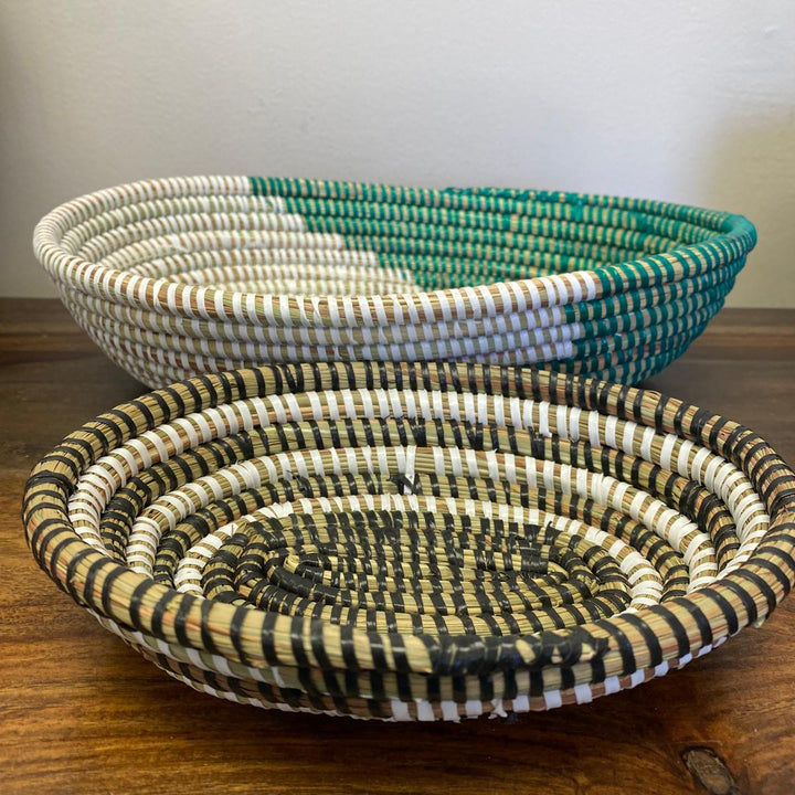 Oval sweetgrass bowl used as tabletop organizer for keys and small items