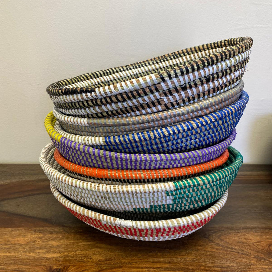 Stacked fair-trade sweetgrass bowls, perfect for everyday use.