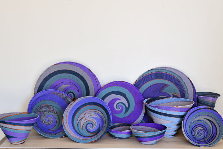 Assorted Purple Zulu Wire Baskets handwoven in South Africa in layered shades of purple and intricate diagonal patterns.