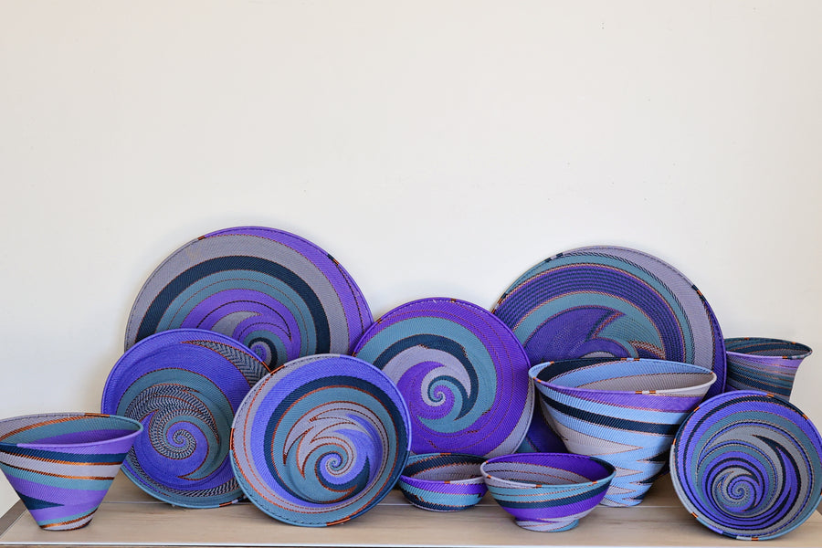 Assorted Purple Zulu Wire Baskets handwoven in South Africa in layered shades of purple and intricate diagonal patterns.