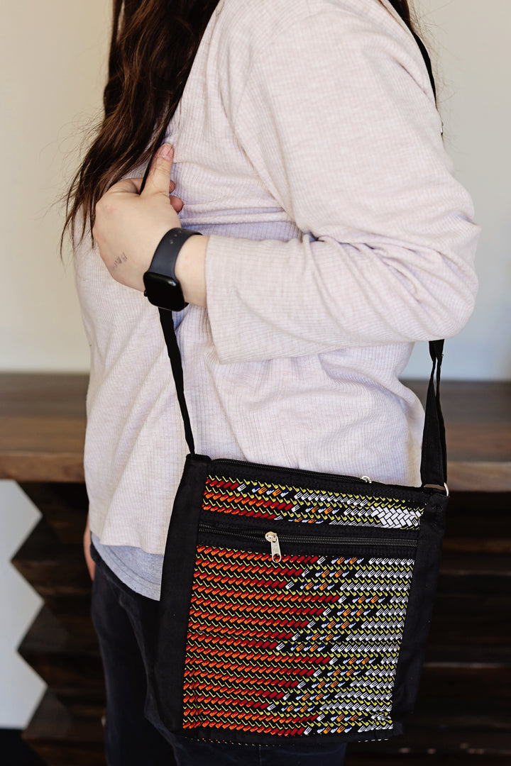 Recycled fabric crossbody bag with zipper closure detail handmade in Kenya