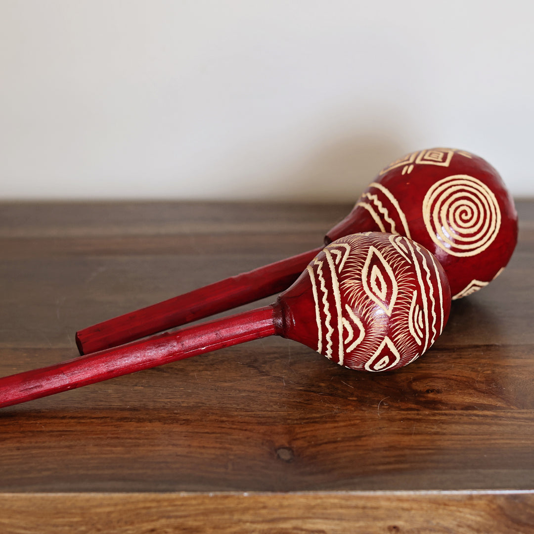 Red hand-painted gourd maraca crafted by Kenyan artisans under fair trade standards