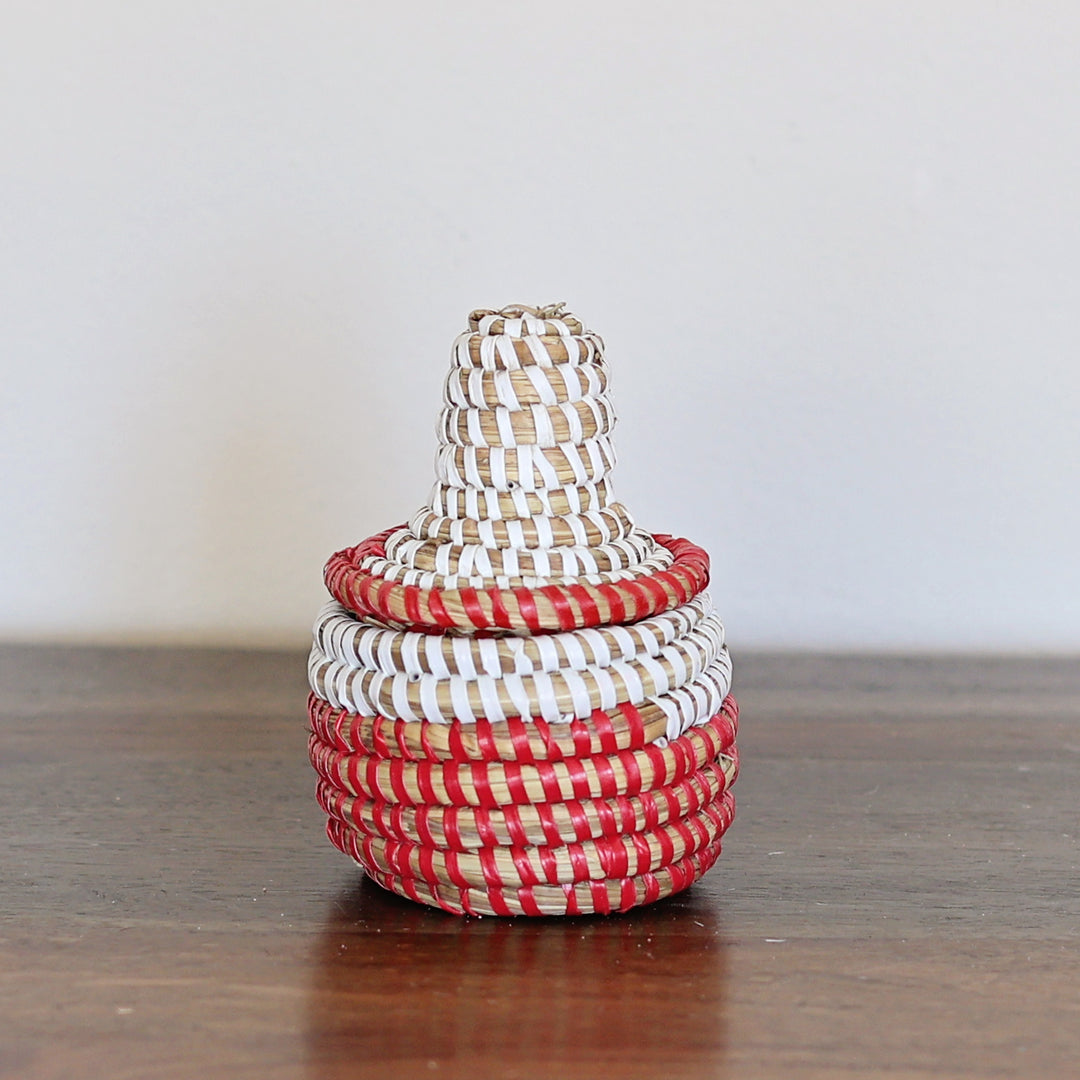 Red and white handwoven mini sweetgrass wishing basket with fitted lid.