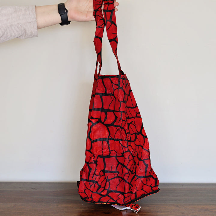 Reusable African print tote bag in red, handcrafted by artisans in Kenya.