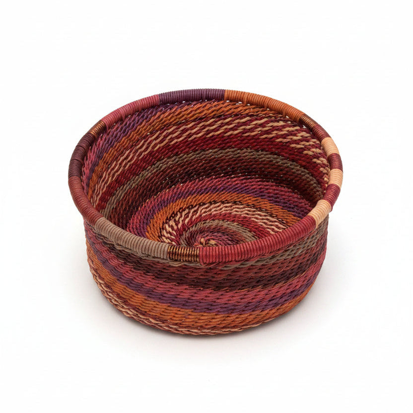 Handwoven Zulu Wire Tuna Cup Baskets in Shiraz from South Africa in a variety of colorful and neutral artisan patterns.