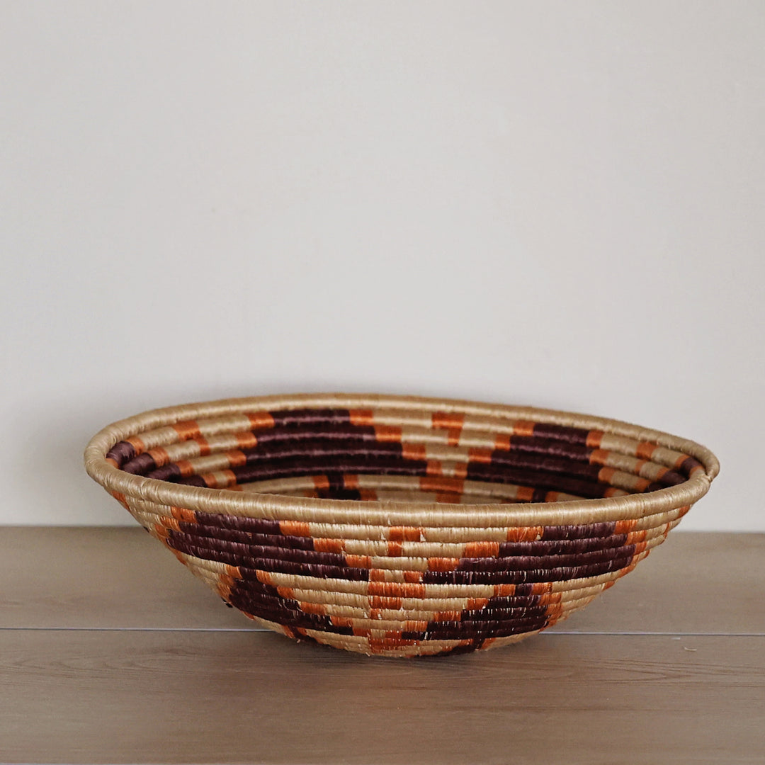 Side view of the Natural, Chocolate & Orange Rwanda Sisal Basket.