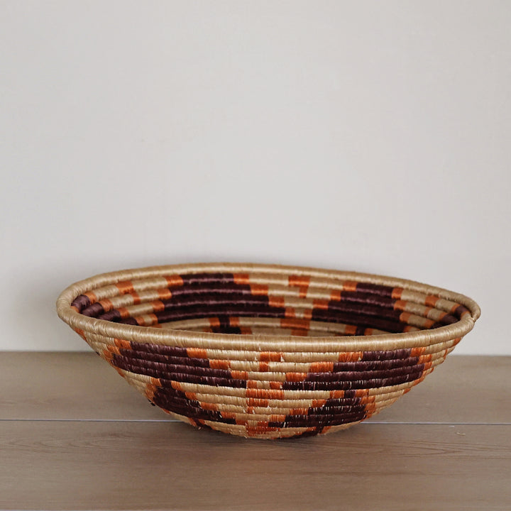 Side view of the Natural, Chocolate & Orange Rwanda Sisal Basket.