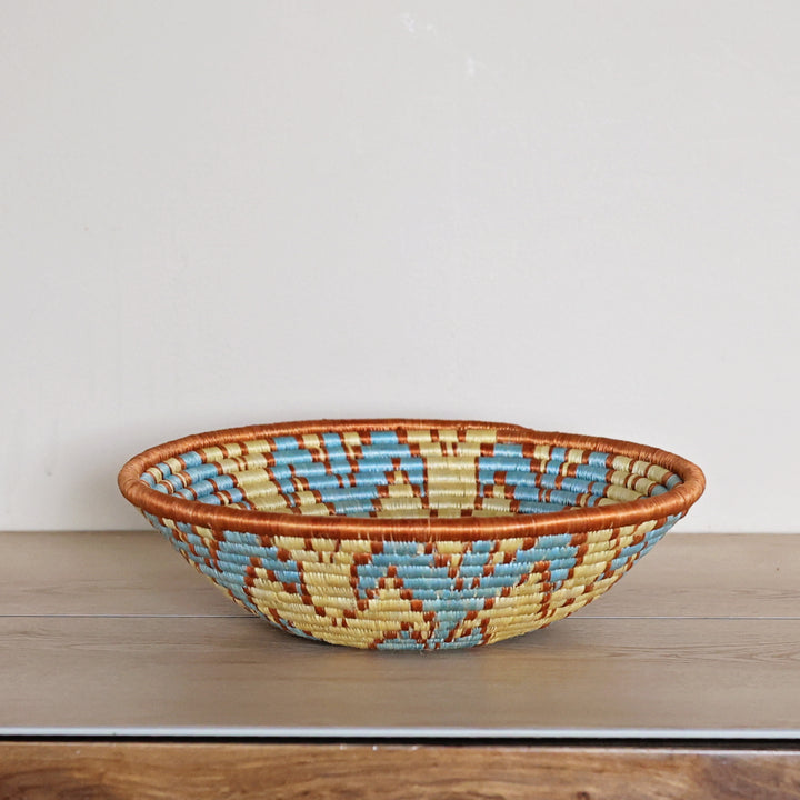 Side view of our handwoven Rwanda Sisal basket. Great gift for the appreciative host!