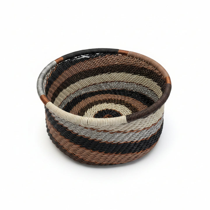 Handwoven Zulu Wire Tuna Cup Baskets in Silver Sand from South Africa in a variety of colorful and neutral artisan patterns.