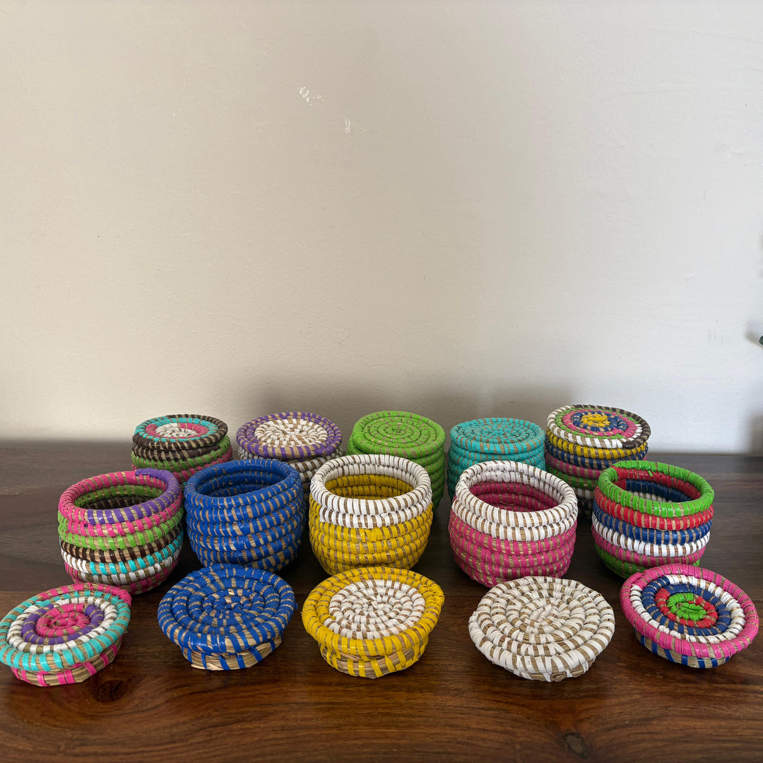 Small handwoven sweetgrass storage baskets with flat lids for organizing