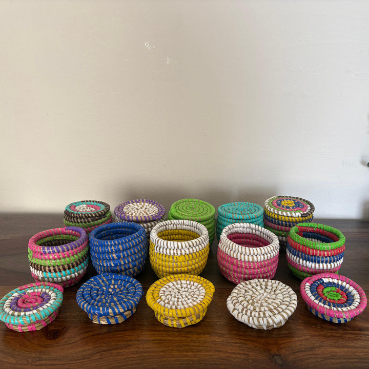 Small handwoven sweetgrass storage baskets with flat lids for organizing